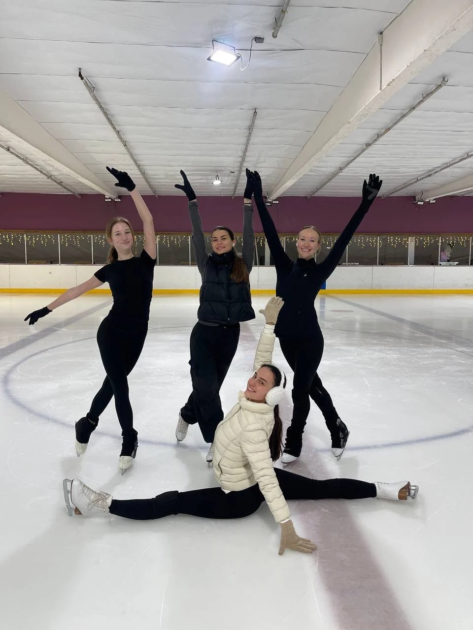 Anastasiia smiling on the ice after a private lesson with Coach Darina